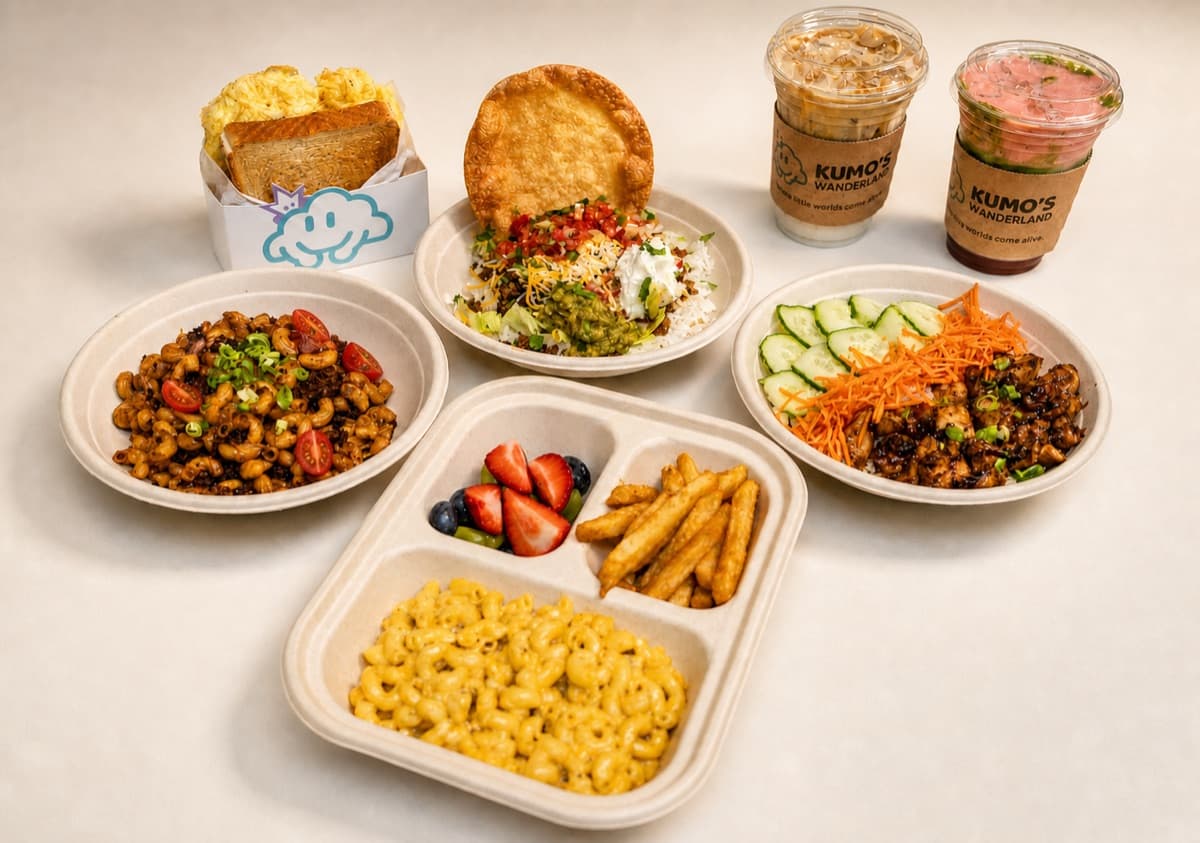 Kumo's Kitchen spread: kids' tray with mac and cheese, fries and fresh fruit, taco rice, honey garlic chicken bowl, and signature drinks